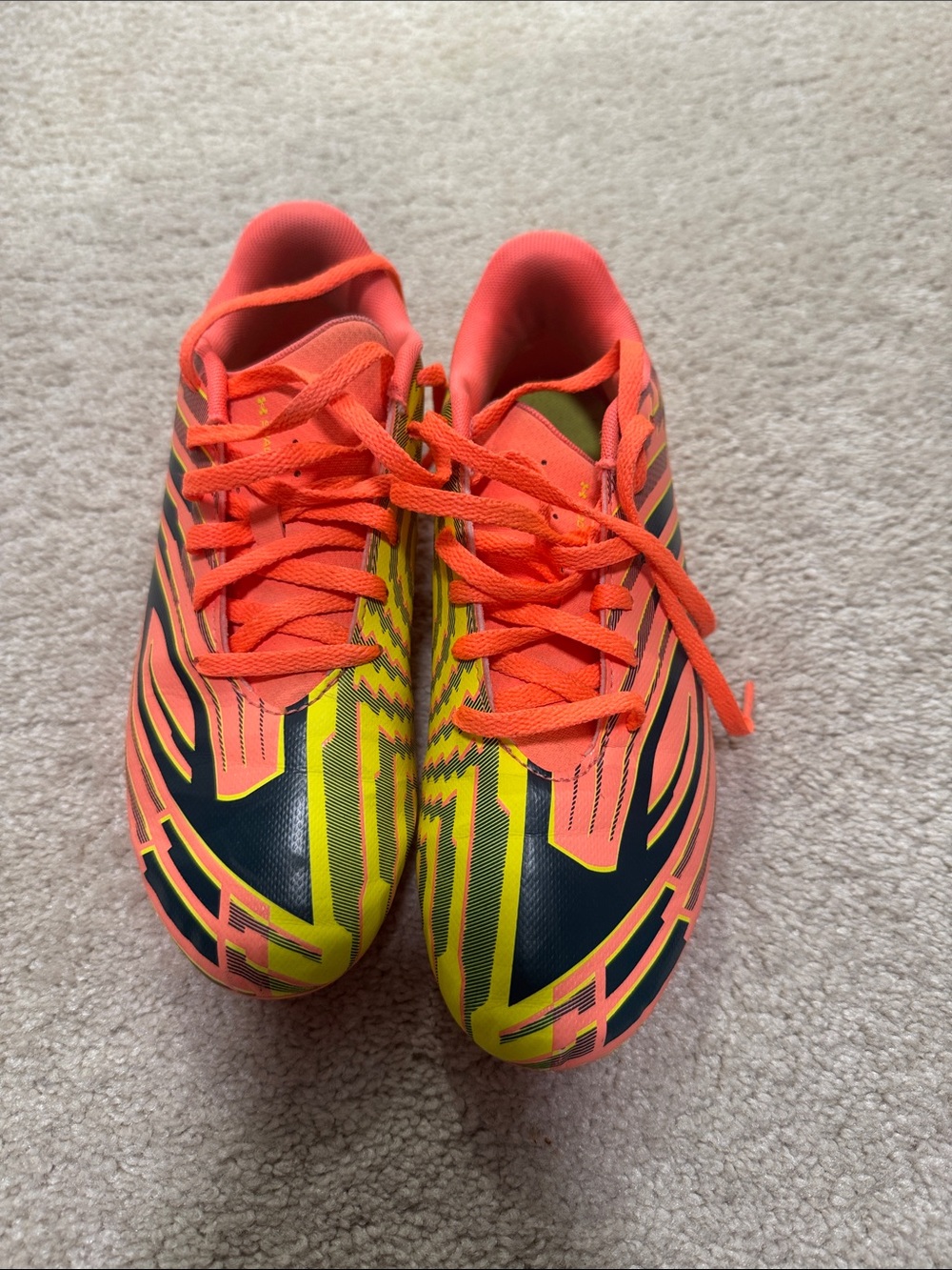 Under Armour Neon Orange and Yellow Kids Soccer Sneakers. Used. Size 5.5Y